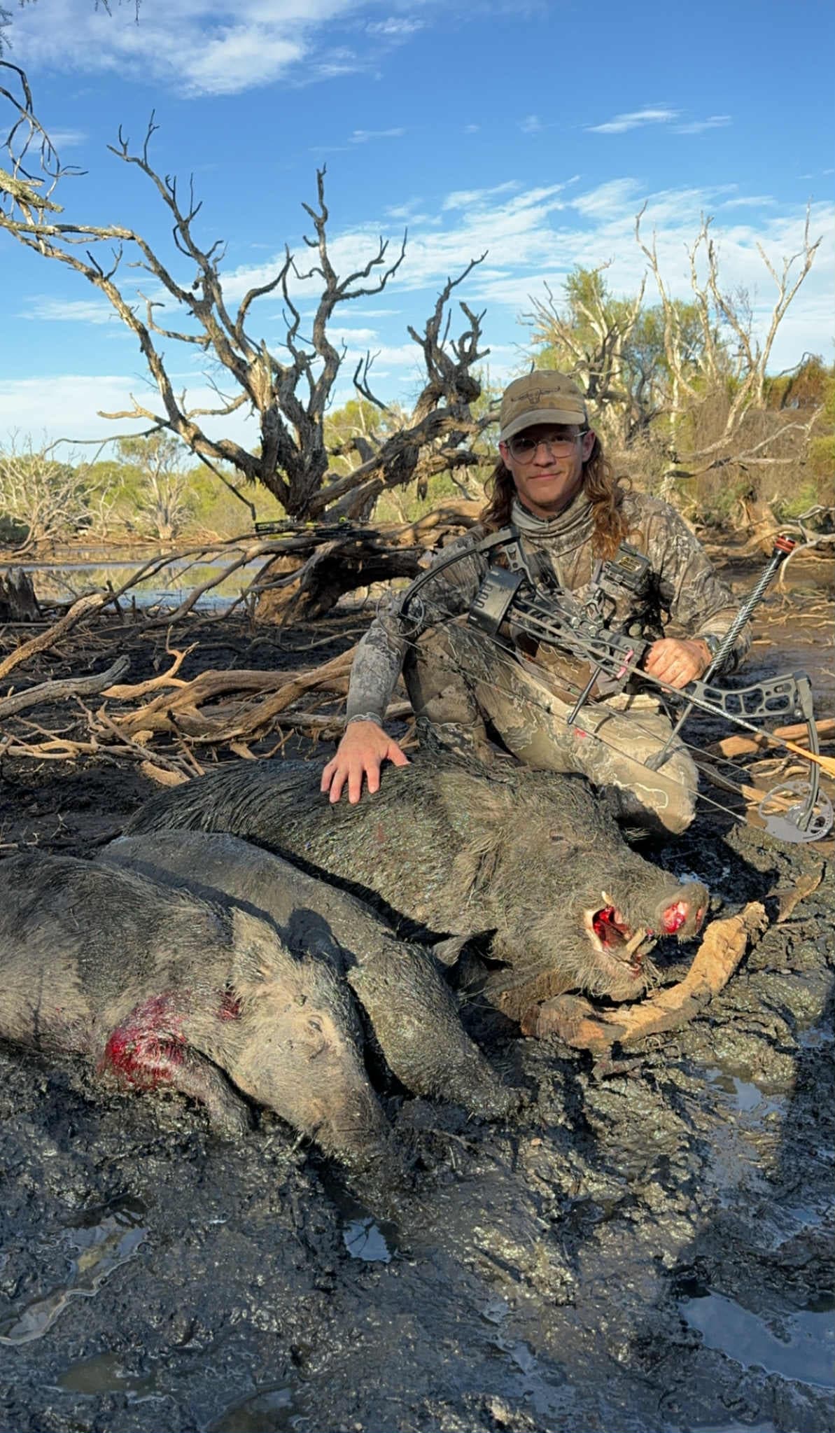 A bowhunter with a successful pig harvest in the WA bush